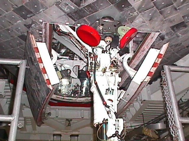 Discovery's heat tiles are clearly seen near the nose landing gear