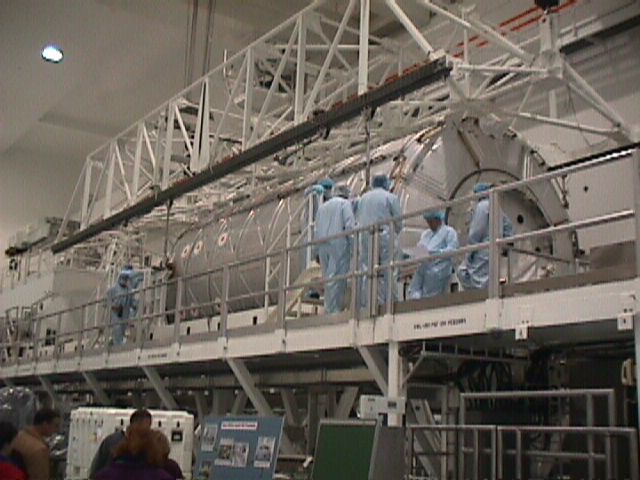 Workers prepare Destiny for shipment to the pad