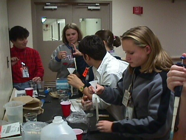 Katie Cauthen assisting students