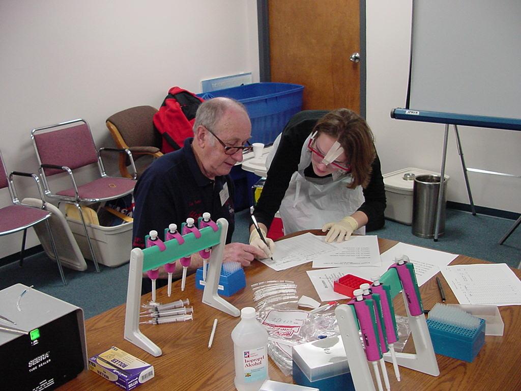 Jim Porter helps student with the 'paperwork'