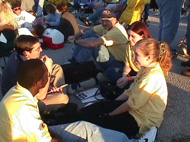 Kevin Clark talking with teacher, Russ Henderlite and students, Tiffany T., Karen P., and Ronnie S., from Peterson Academy, Duval County