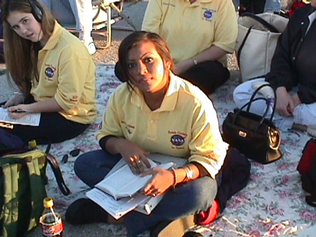 Sovannary C. (center) and Kelli F. from Terry Parker HS, Duval County doing homework prior to the launch