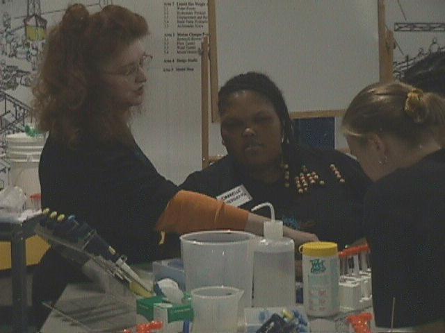 Anna Homles helps Danielle Stephens make her droplets.
