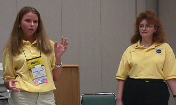 Anna Holmes observes Kimberly discussing protein crystallization