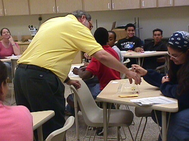 Mr. Smith checks to see if the salt has dissolved.