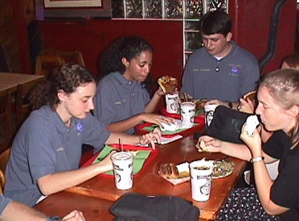 Students relax with pizza at Leonardo's after the workshop