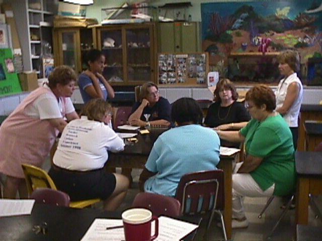 Marge Hayden (on the right), USI Instructor, monitoring the progress of the lab activity